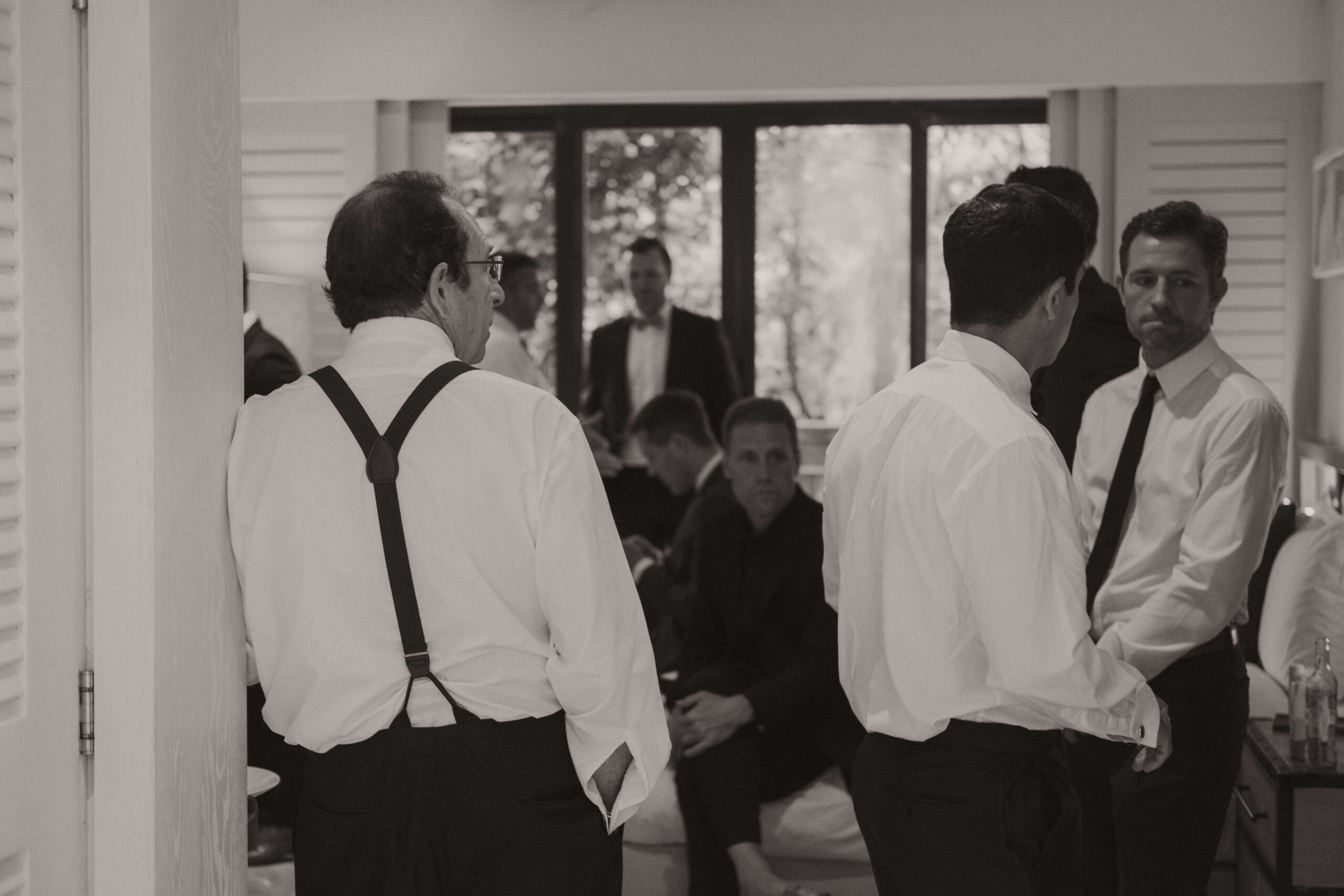American Groomsmen, father stand around getting ready for Mexico wedding