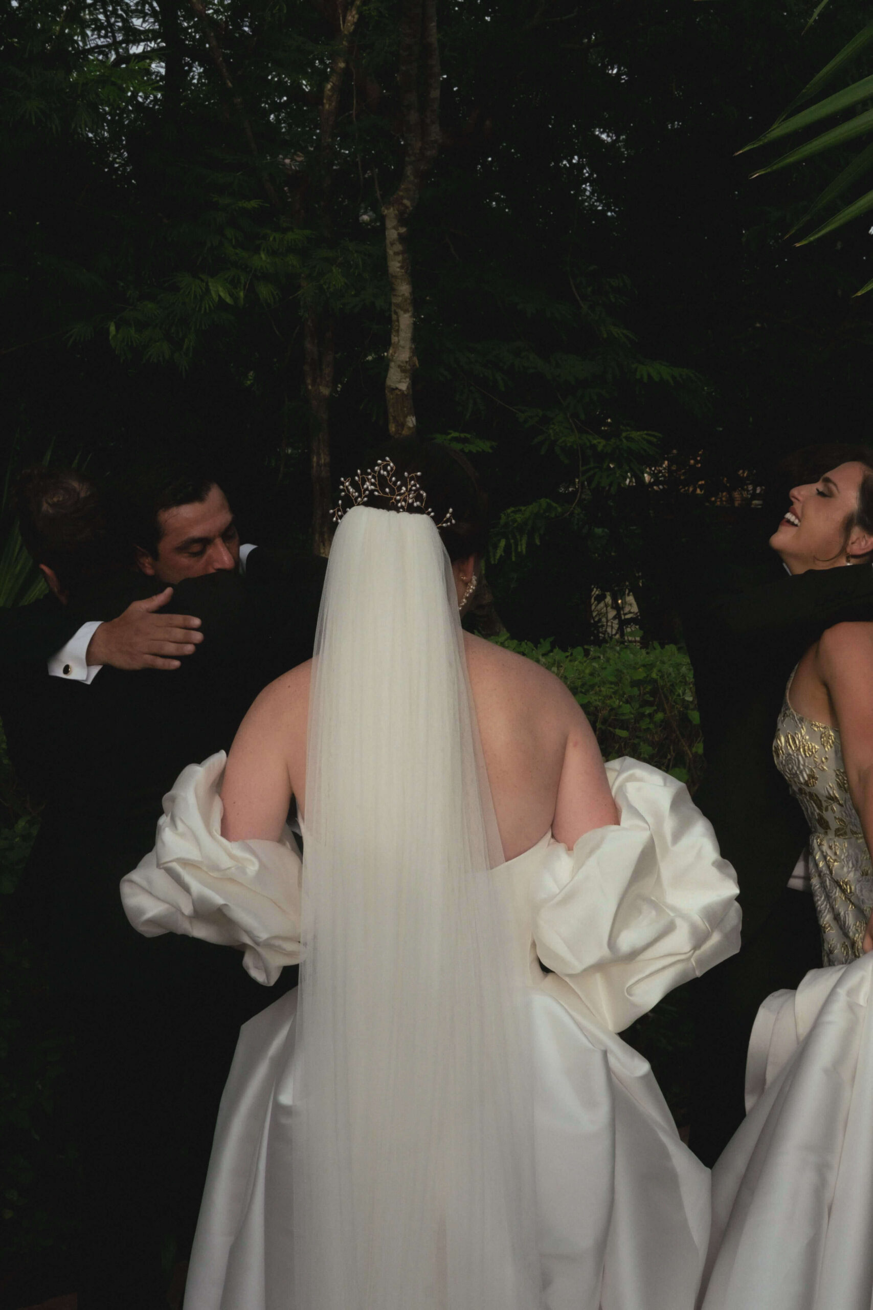 American bride at Playa del Carmen wedding. Dark edit of veil and bridal dress after wedding ceremony